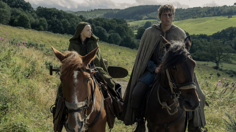 Dexter Sol Ansell as Egg and Peter Claffey as Ser Duncan the Tall riding horses together in A Knight of the Seven Kingdoms