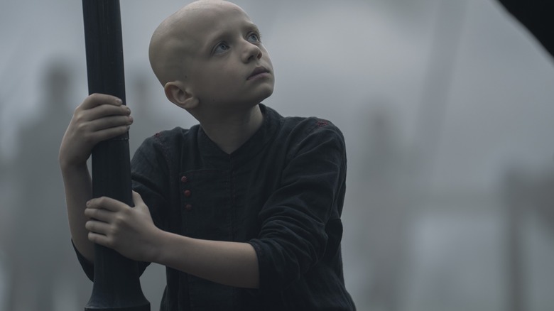 Dexter Sol Ansell as Egg holding onto a spear and looking up in A Knight of the Seven Kingdoms