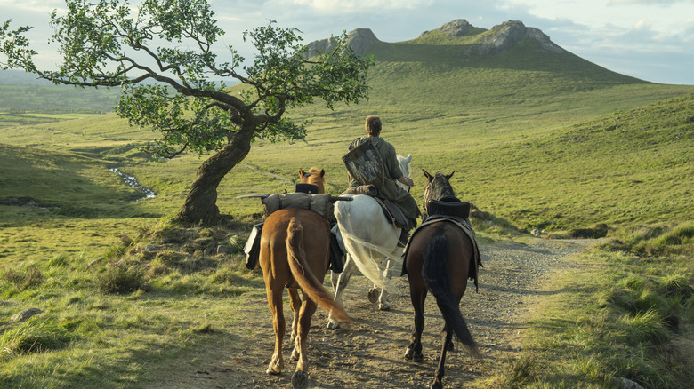 Ser Duncan riding one horse with two in tow on A Knight of the Seven Kingdoms