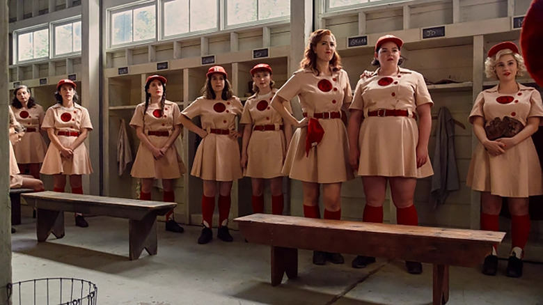 eight women in old school professional baseball uniforms in amazon prime's a league of their own