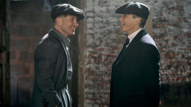 Barry Keoghan as Duke Shelby sharing a laugh with Cillian Murphy as Tommy Shelby in a behind-the-scenes still from the set of Peaky Blinders: The Immortal Man