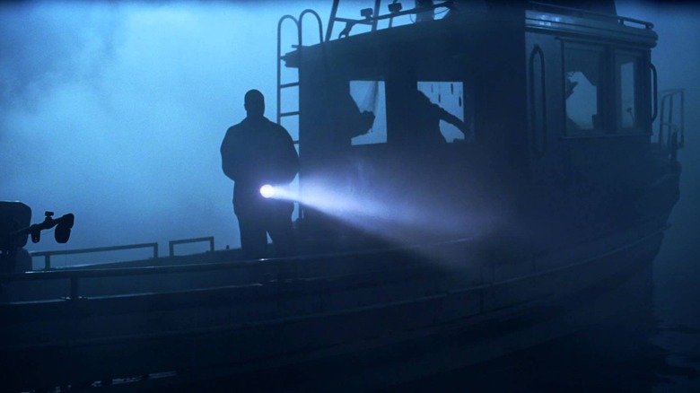 A boat out on the water covered in mist in The Fog (2005)