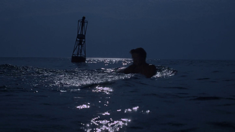 Chrissie gets dragged past the famous lone buoy in Jaws
