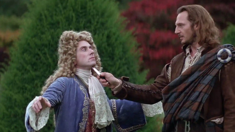 Rob Roy holding a knife to Cunningham's throat in Rob Roy