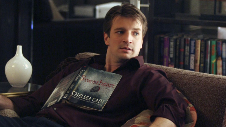 Castelo em uma cadeira, um livro aberto de estômago na série de TV Castle