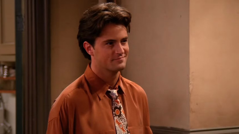 Chandler Bing smirking in an episode of Friends