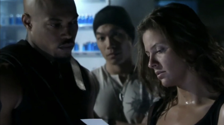 Kirk "Sticky Fingaz" Jones' Eric Brooks/Blade stand with Jill Wagner's Krista Starr and Nelson Lee's Shen in Blade: The Series