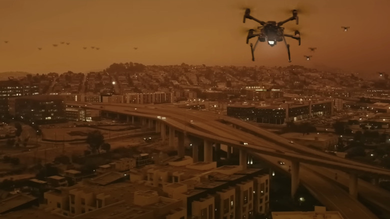 Drones fly over a city in 2073