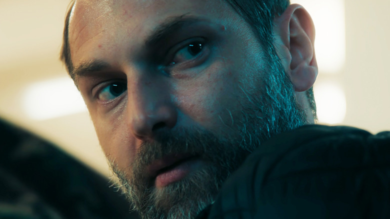 Admir Sehovic's Ilian Petrov sits looks off to the right in closeup in iHostage