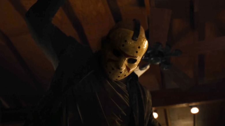 Schuyler White as Jason Voorhees getting ready to kill a victim in a cabin in Sweet Revenge
