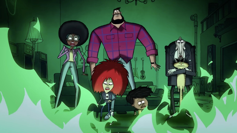 London Hughes as Alicia Pennyworth, Haley Tju as Volcana, Luke Wilson as Bruce Wayne, Yonas Kibreab as Damien Wayne, and James Cromwell as Alfred are beset by green flames in Bat-Fam