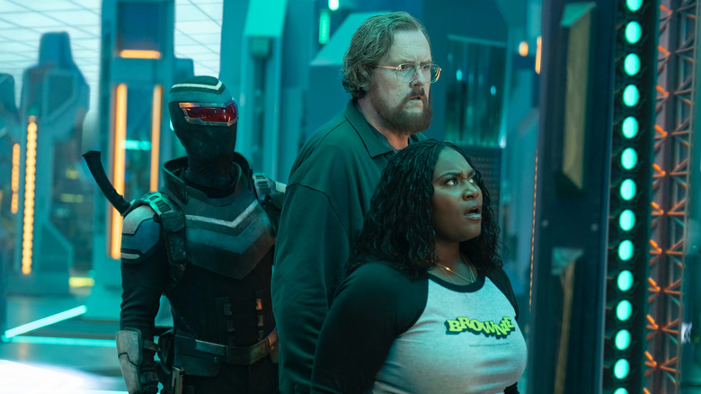 Vigilante, Economos, and Adebayo gazing at the Quantum Unfolding Storage Area in Peacemaker