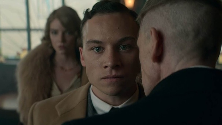 Michael Gray being held back by Arthur Shelby