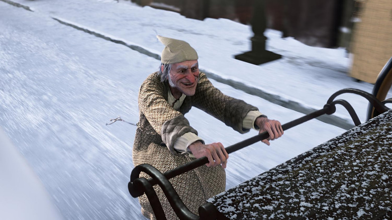 Scrooge riding the back of a carriage in A Christmas Carol (2009)