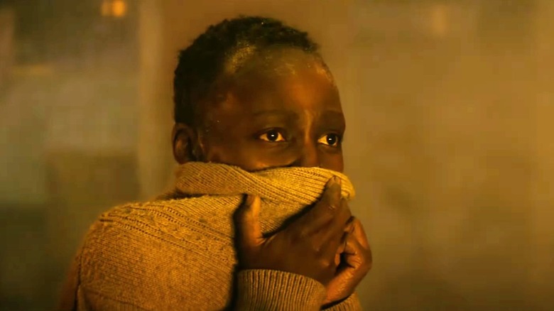 quiet place day one nyong'o covered mouth