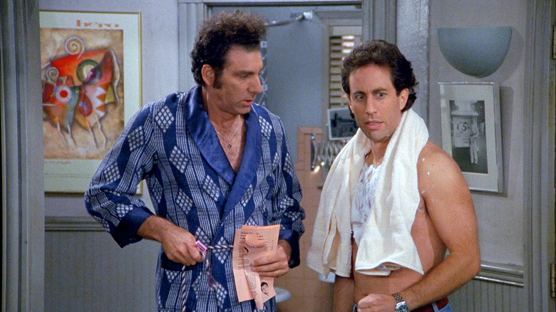 Kramer in a robe and Jerry about to chave his chest in an episode of Seinfeld.