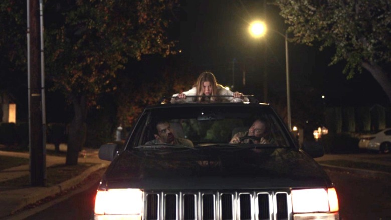 Lily on top of Barry and Fuches' Car