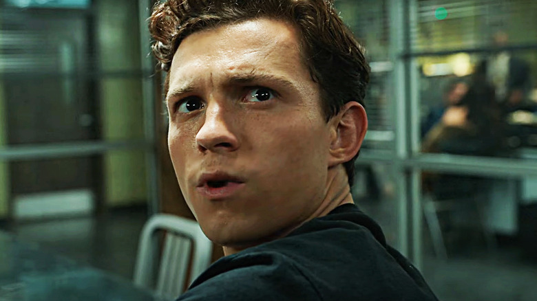 Tom Holland's Peter Parker looks over his shoulder in Spider-Man: No Way Home
