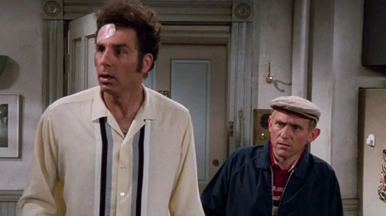 Kramer standing on front of Stan on Seinfeld