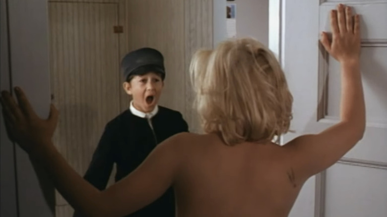 Joseph Gordon-Levitt's Ezekiel Jacobson screams as Patricia Arquette's Betsy Havana Iggins stands naked in a doorway in Holy Matrimony