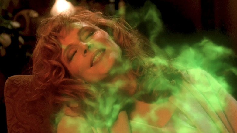 Dr. Crusher smiling as green mist moves over her in Star Trek: The Next Generation