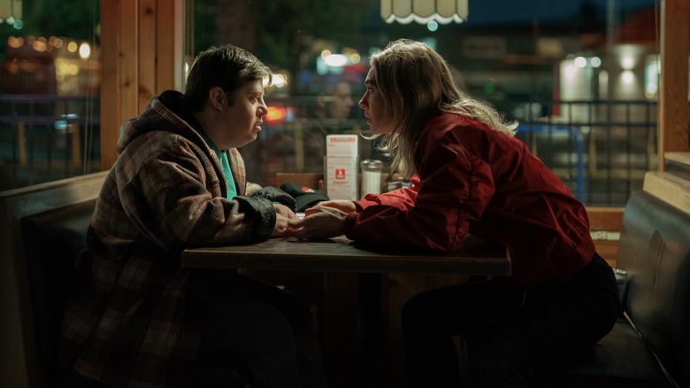 Lynette and Kenny sitting at a table in 