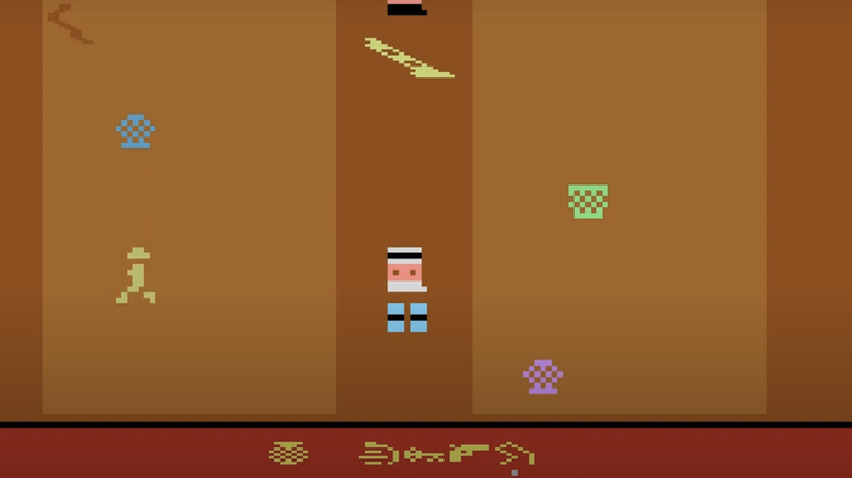 A video game version of Indiana Jones is seen in an orange level in the Raiders of the Lost Ark video game