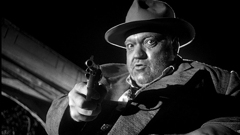 Touch Of Evil Orson Welles pointing gun at camera