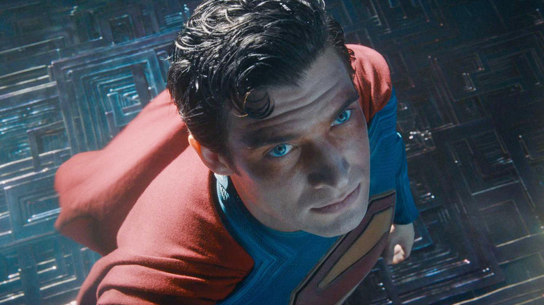 David Corenswet as Superman staring upwards in Superman