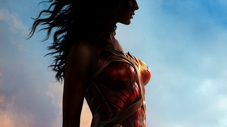 Gal Gadot as Wonder Woman cloaked in shadow on the poster for Wonder Woman