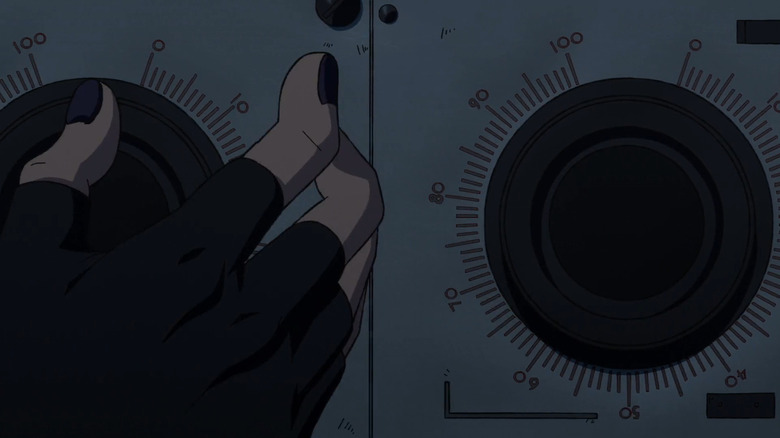 A hand dialing knobs in Dan Da Dan