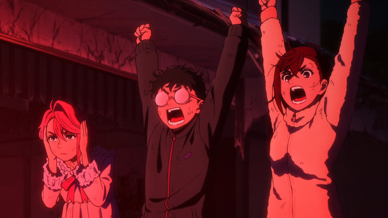 Okarun and Ayase enthusiastically raise their hands while Aira covers her ears in Dan Da Dan