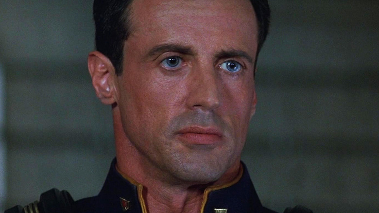Sylvester Stallone's Judge Joseph Dredd looks across frame in Judge Dredd
