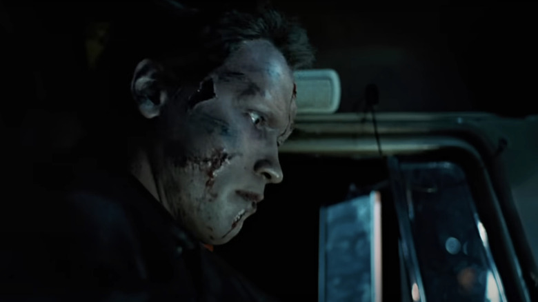 Arnold Schwarzenegger's Terminator is seen in profile with injuries on his face in The Terminator