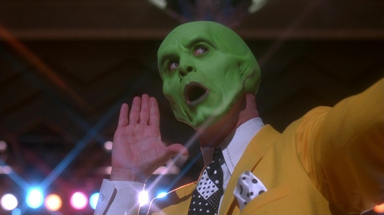 Jim Carrey strikes a winning showbiz pose as a green-faced Stanley Ipkiss in The Mask