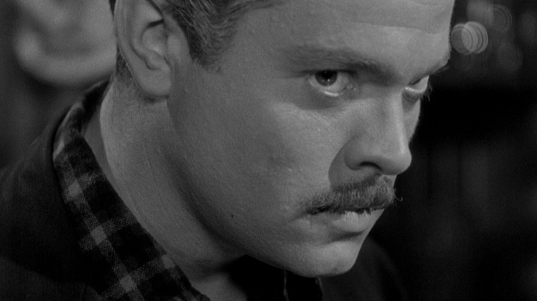 Orson Welles as Franz Kindler staring intensely in The Stranger
