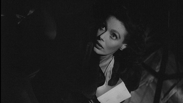 Loretta Young as Mary Longstreet Rankin looking up in concern in The Stranger