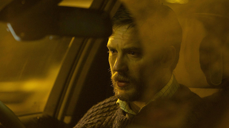 Ivan Locke looking distressed in his car in Locke
