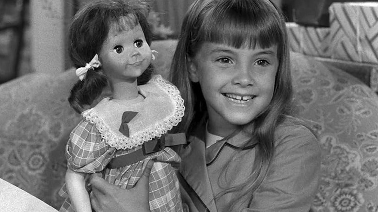 Young Christie proudly holds up her creepy Talky Tina doll on The Twilight Zone (1963)