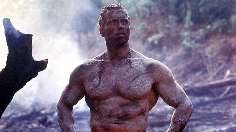 Arnold Schwarzenegger as Dutch shirtless and covered in mud in Predator