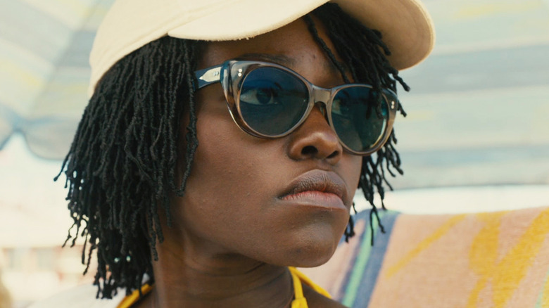Lupita Nyong'o's Adelaide Wilson is seen in closeup wearing shades in Us