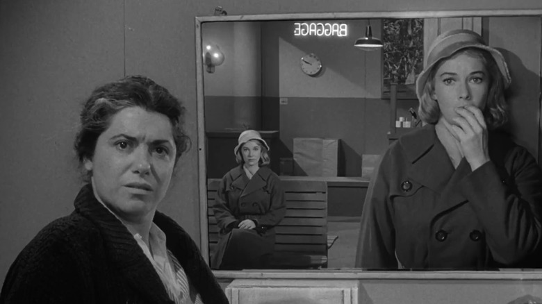 Vera Miles' Millicent Barnes looks shocked as she sees her double in a mirror while Naomi Stevens' washroom attendant looks on puzzled in The Twilight Zone