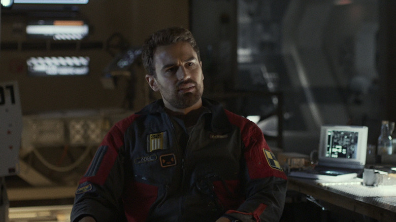 Theo James's George Almore sits in his lab in Archive