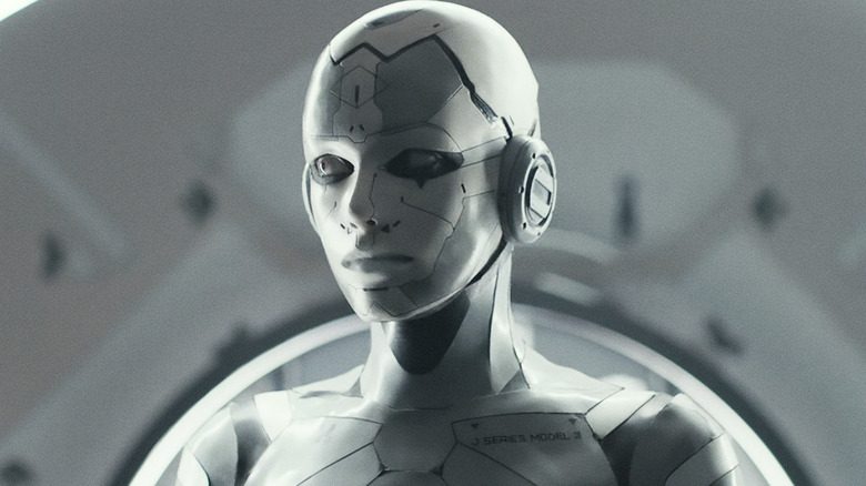 Stacy Martin's Jules Almore/J3 looks off to her right in closeup in Archive