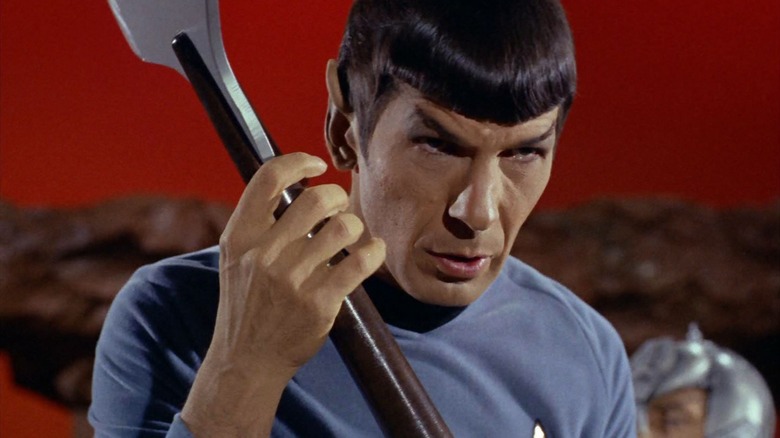 Spock, against a red sky, holding a bladed weapon, from an episode of Star Trek