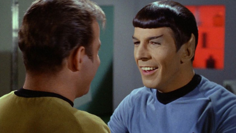 Spock, smiling at Kirk, in an episode of Star Trek
