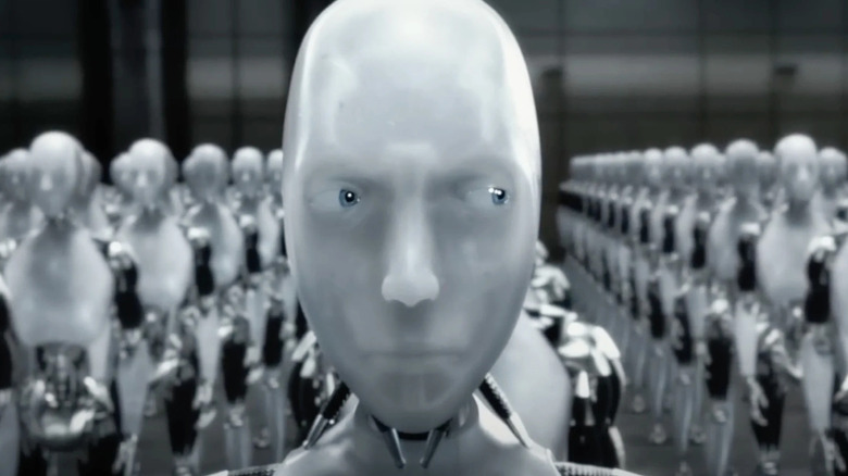 Sony (Alan Todic) is hiding from Detective Del Sponner (Will Smith) in I, Robot