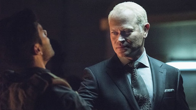 Damien Darhk threatening a man in Arrow
