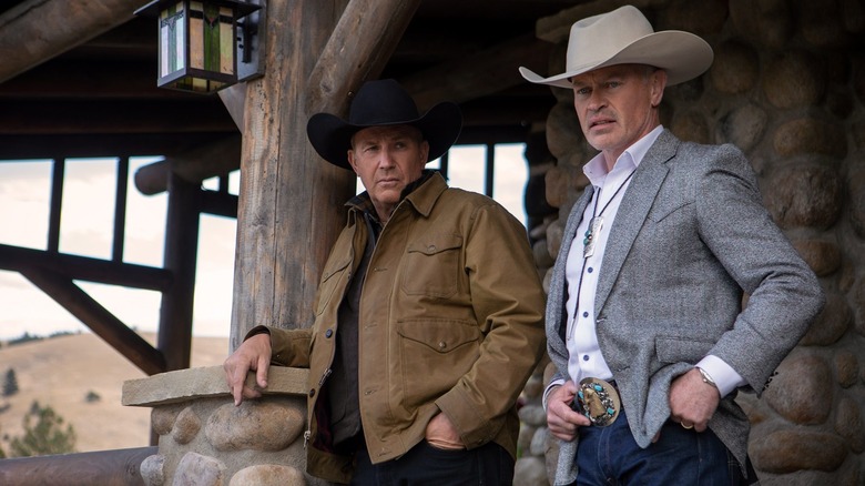 John Dutton and Malcolm Beck hanging out on a porch in Yellowstone