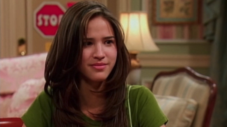 Kelsey Asbille's Dakota is seen sitting in a living room in The Suite Life of Zack and Cody